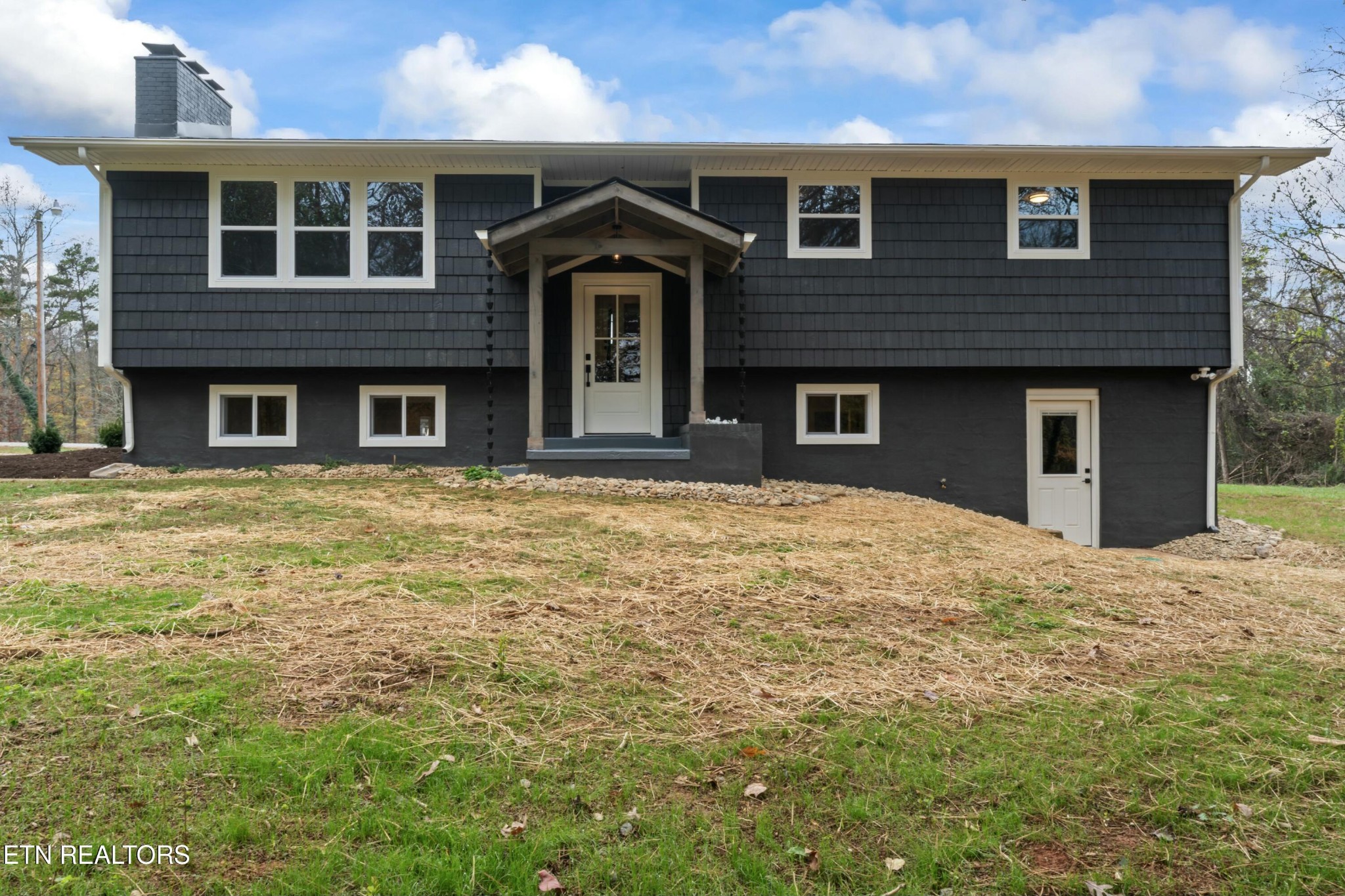 2229 Tooles Bend Road Knoxville, TN 37922 - Photo 1 of 41 a front view of a house with a garden