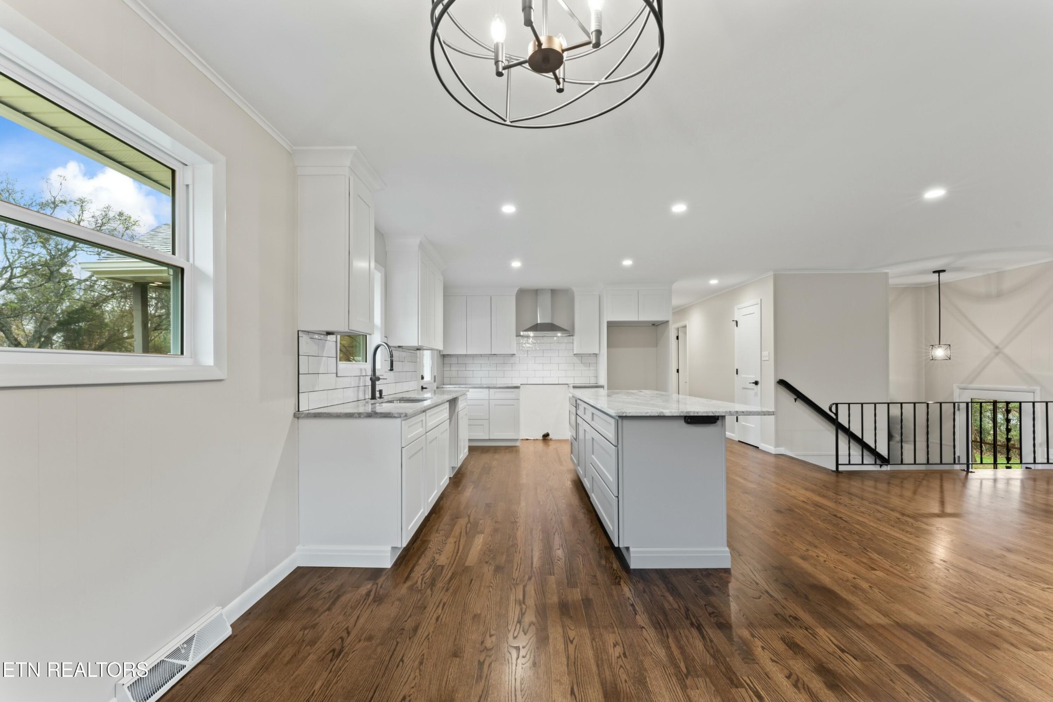 2229 Tooles Bend Road Knoxville, TN 37922 - Photo 11 of 41 a kitchen with a white cabinets and wooden floor
