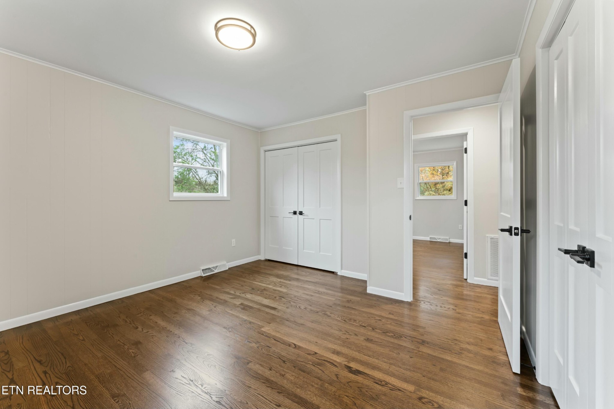 2229 Tooles Bend Road Knoxville, TN 37922 - Photo 18 of 41 an empty room with wooden floor and a window