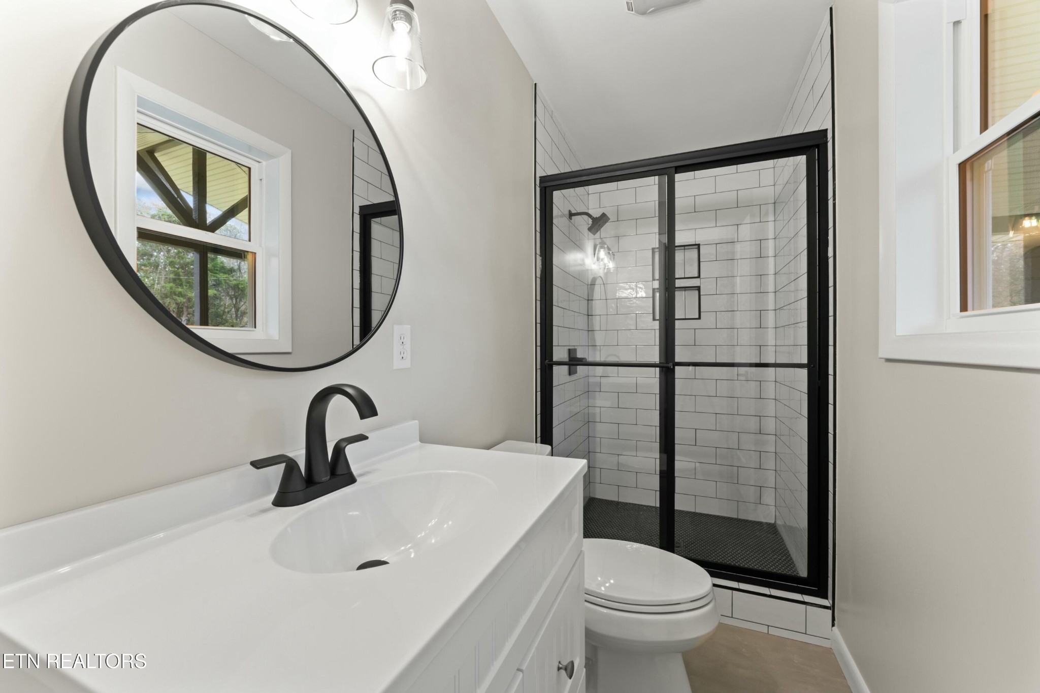 2229 Tooles Bend Road Knoxville, TN 37922 - Photo 19 of 41 a bathroom with a toilet a sink and a mirror