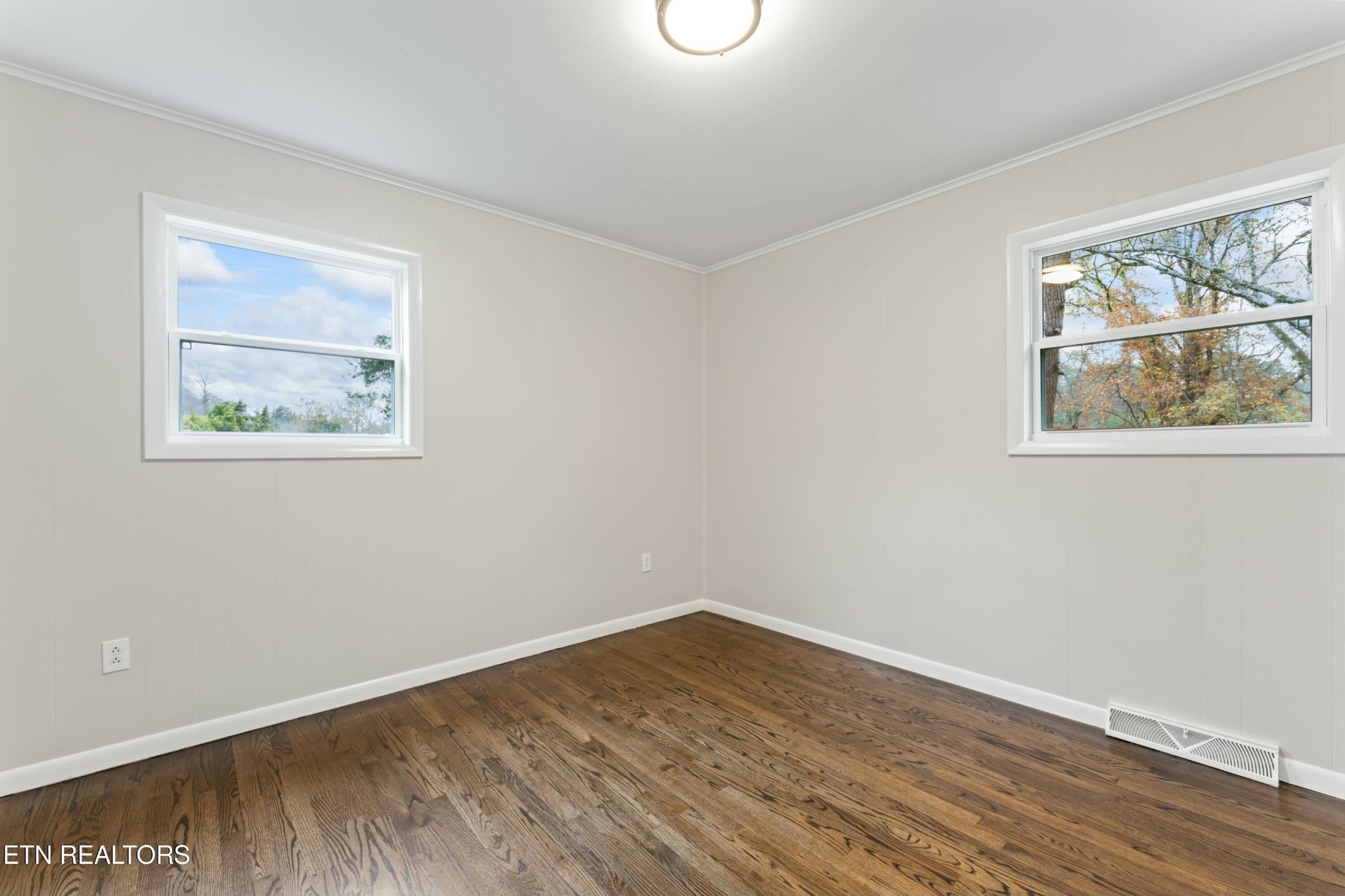 2229 Tooles Bend Road Knoxville, TN 37922 - Photo 20 of 41 a view of an empty room with wooden floor and window