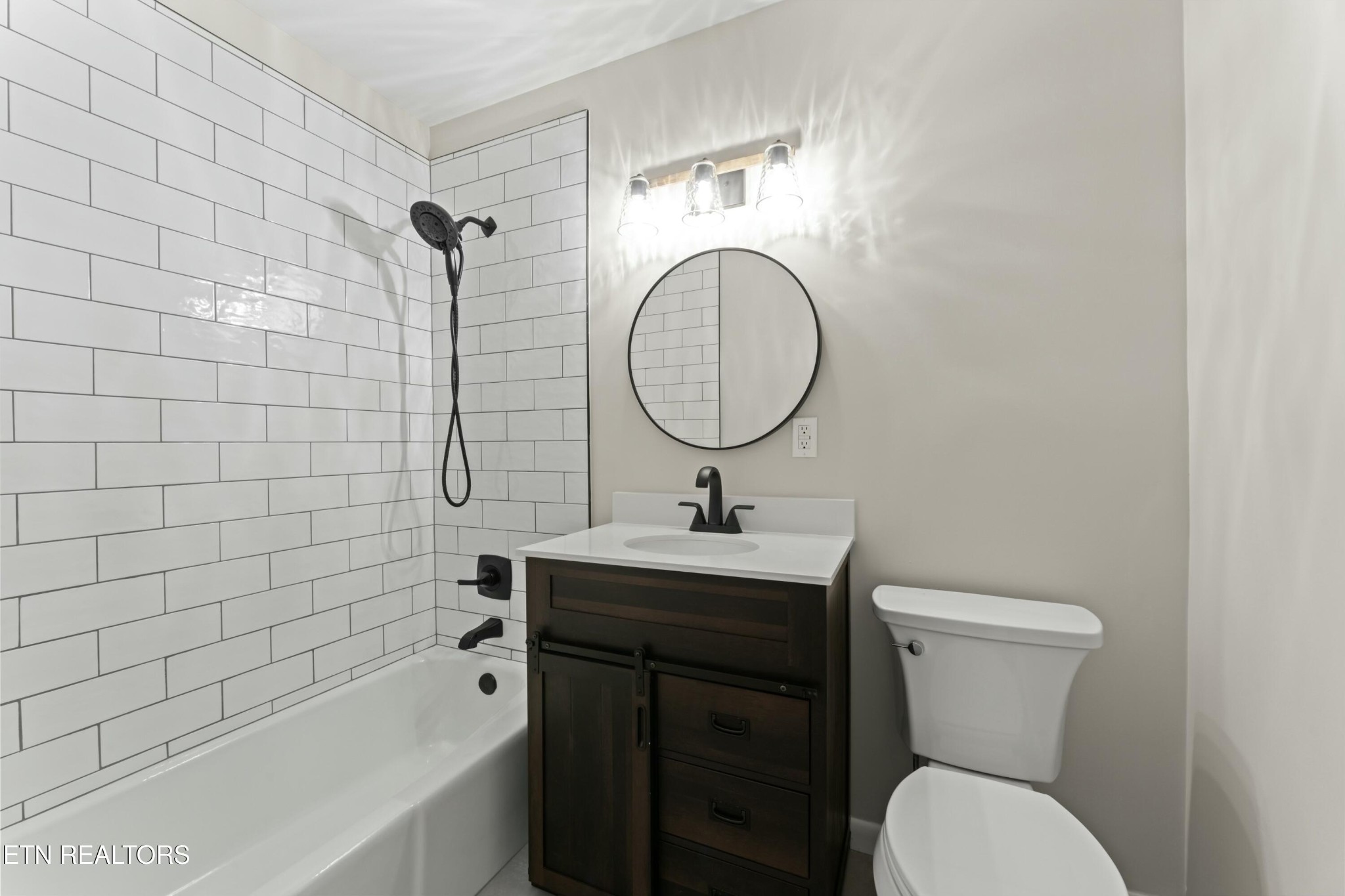 2229 Tooles Bend Road Knoxville, TN 37922 - Photo 22 of 41 a bathroom with a sink a toilet and bathtub