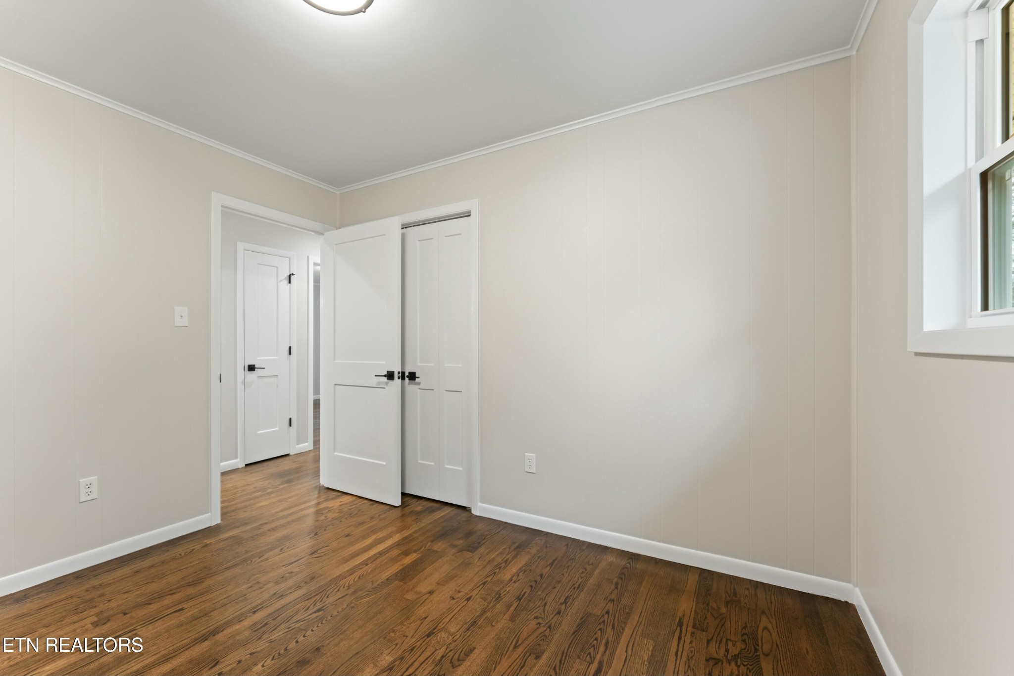 2229 Tooles Bend Road Knoxville, TN 37922 - Photo 24 of 41 a view of an empty room with wooden floor and a window