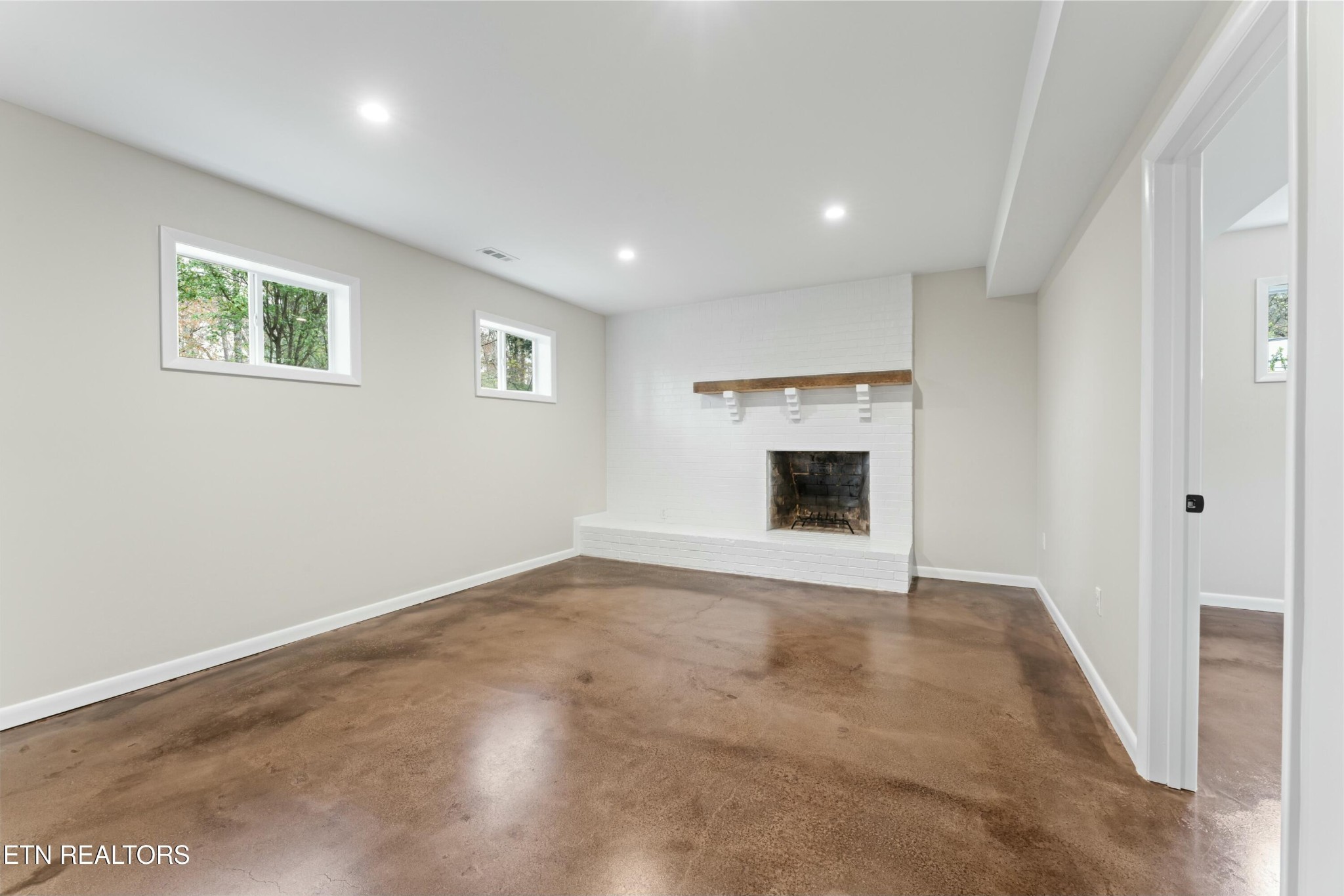 2229 Tooles Bend Road Knoxville, TN 37922 - Photo 25 of 41 a view of an empty room with a fireplace and a window