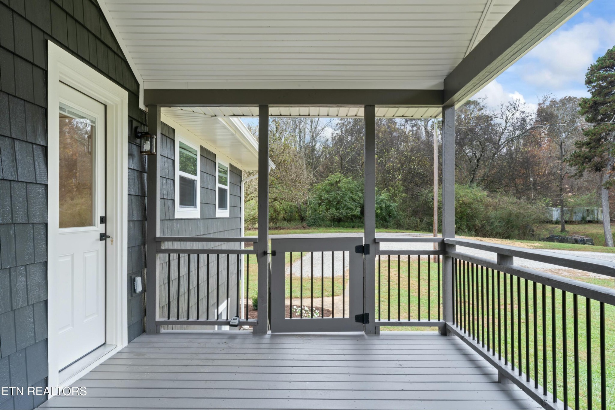 2229 Tooles Bend Road Knoxville, TN 37922 - Photo 35 of 41 a view of a porch with wooden floor and stairs