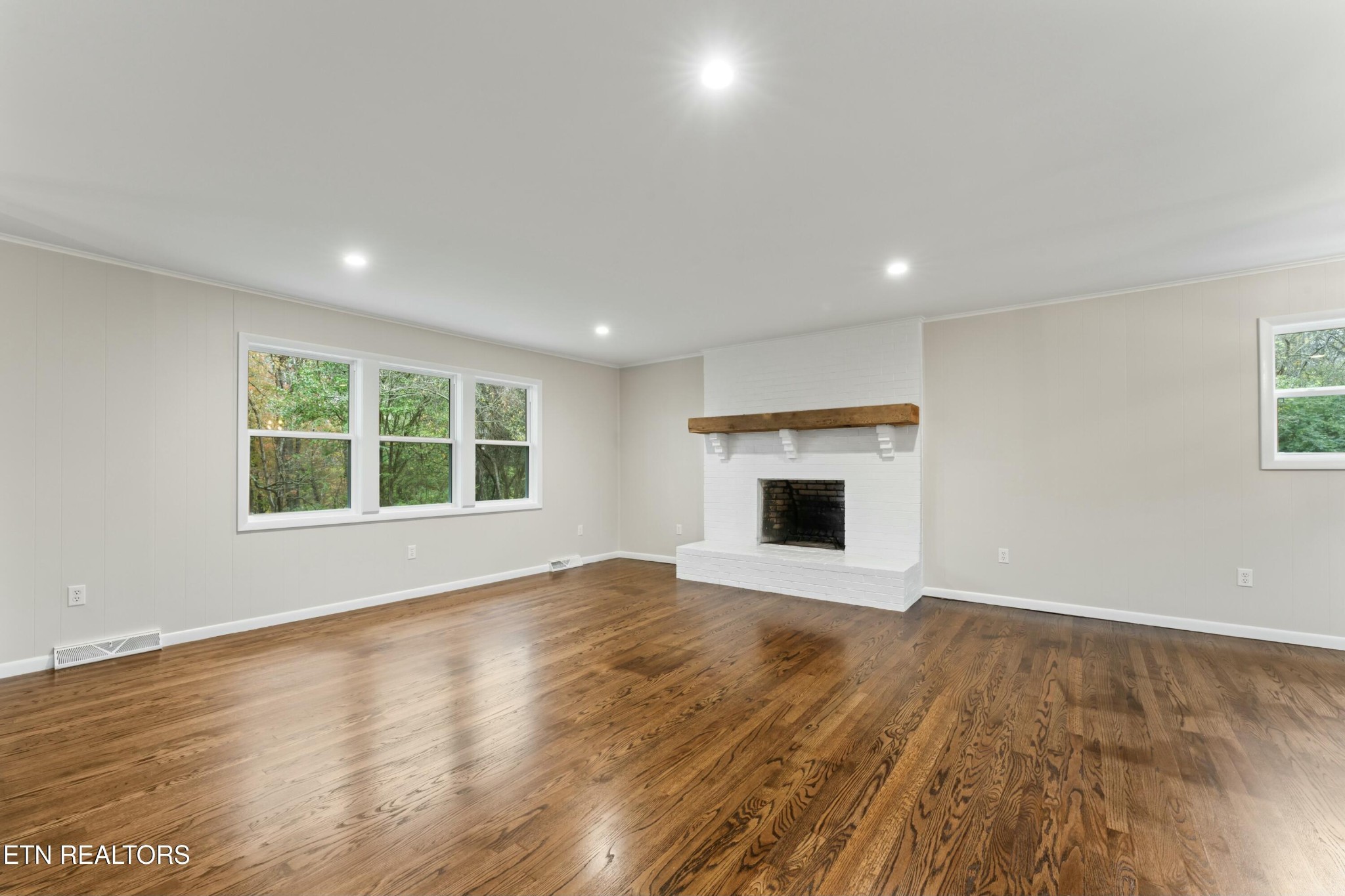2229 Tooles Bend Road Knoxville, TN 37922 - Photo 7 of 41 a view of an empty room with window and wooden floor