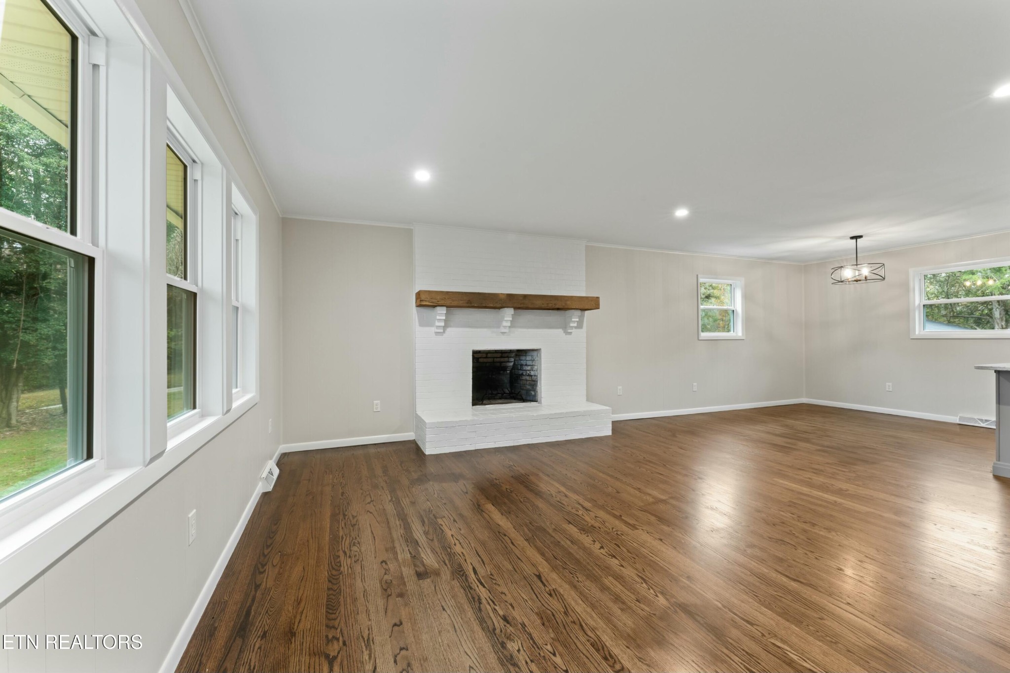 2229 Tooles Bend Road Knoxville, TN 37922 - Photo 8 of 41 an empty room with wooden floor and windows