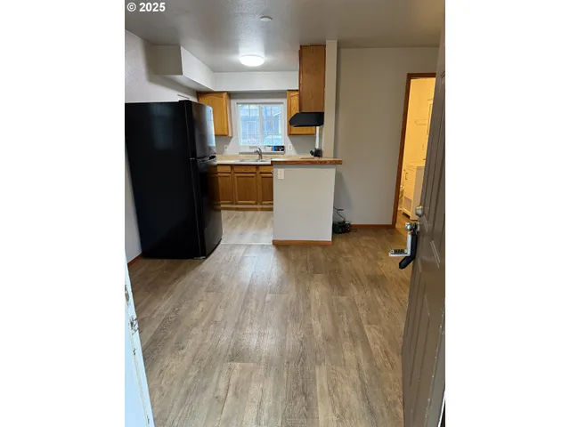 a kitchen with stainless steel appliances a refrigerator and a sink
