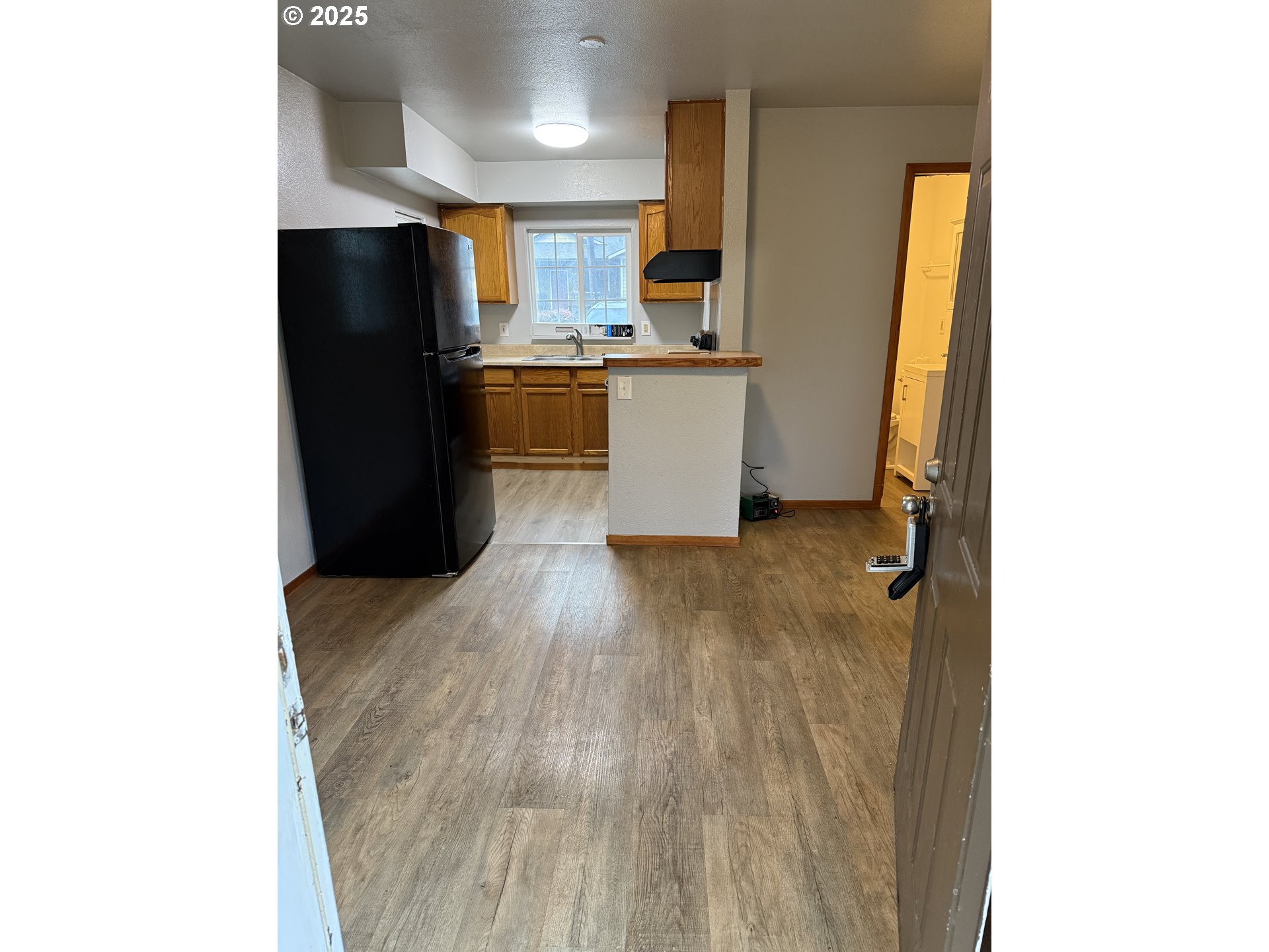 204 Southwest Water Street Sheridan, OR 97378 - Photo 3 of 9 a kitchen with stainless steel appliances a refrigerator and a sink