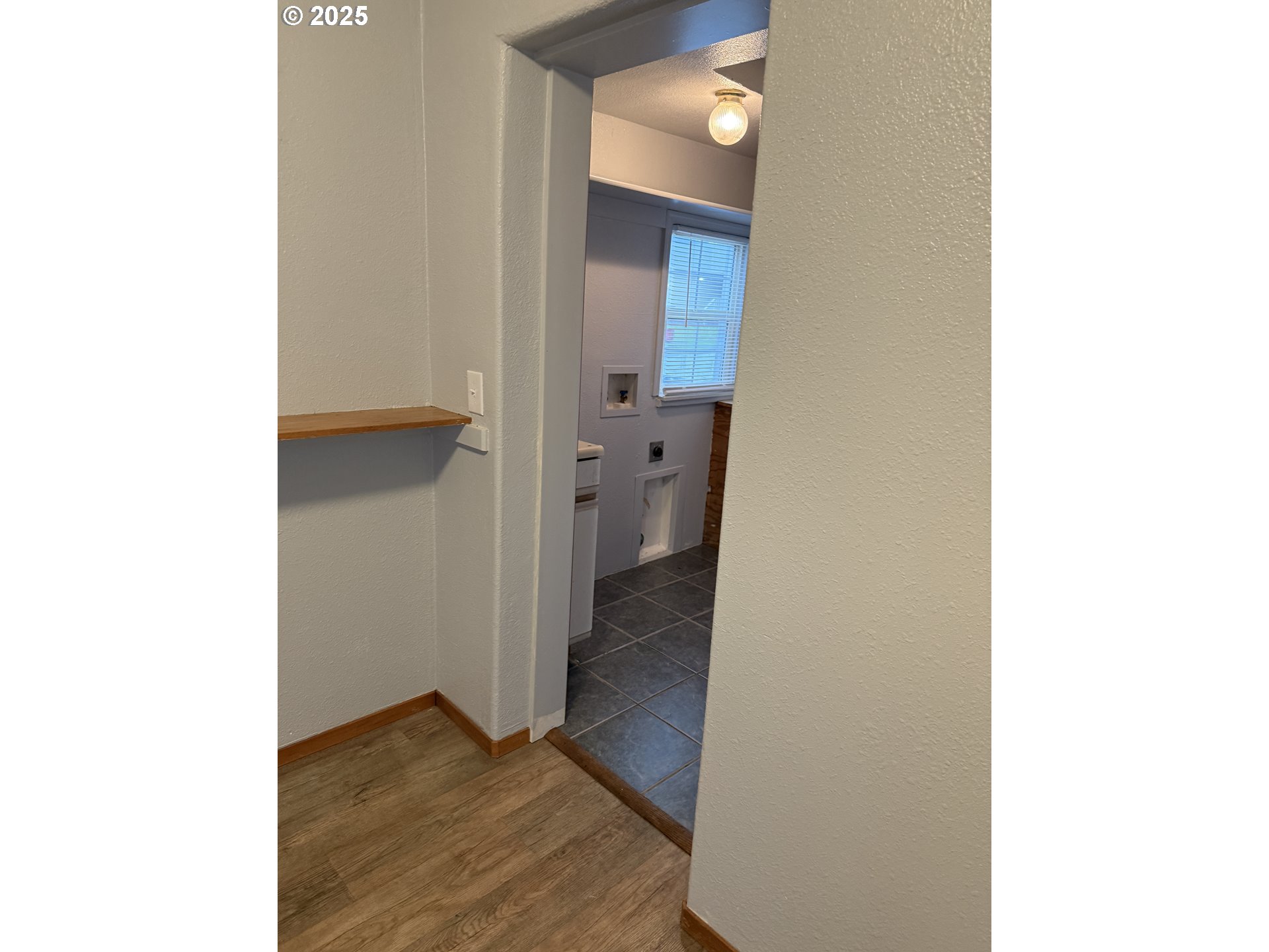 204 Southwest Water Street Sheridan, OR 97378 - Photo 7 of 9 a view of a hallway with wooden floor