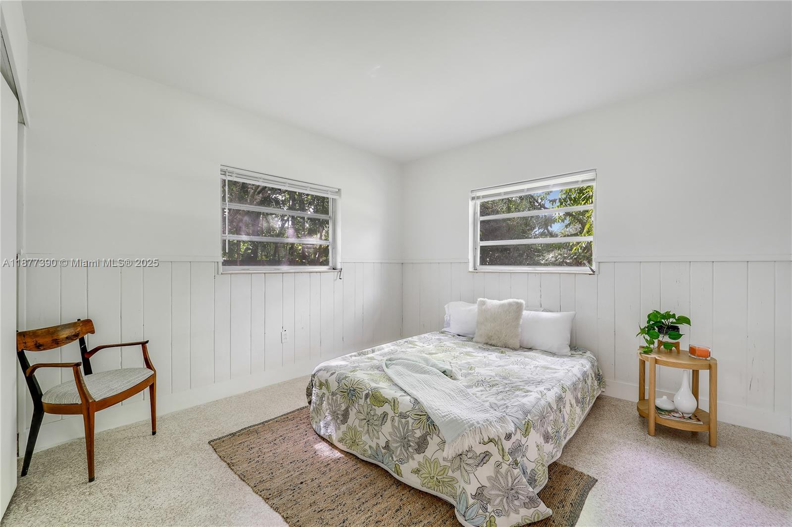 6445 Southwest 46th Terrace Miami, FL 33155 - Photo 14 of 22 a bedroom with a bed and a painting on the wall