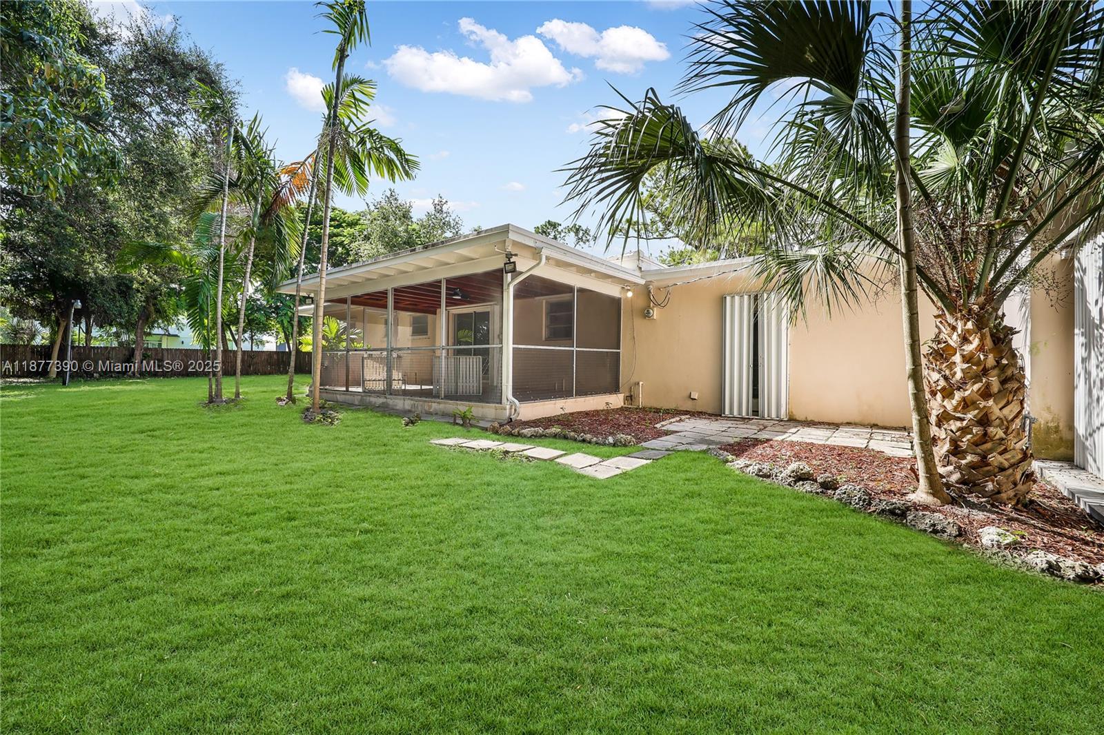 6445 Southwest 46th Terrace Miami, FL 33155 - Photo 21 of 22 a view of a house with a backyard