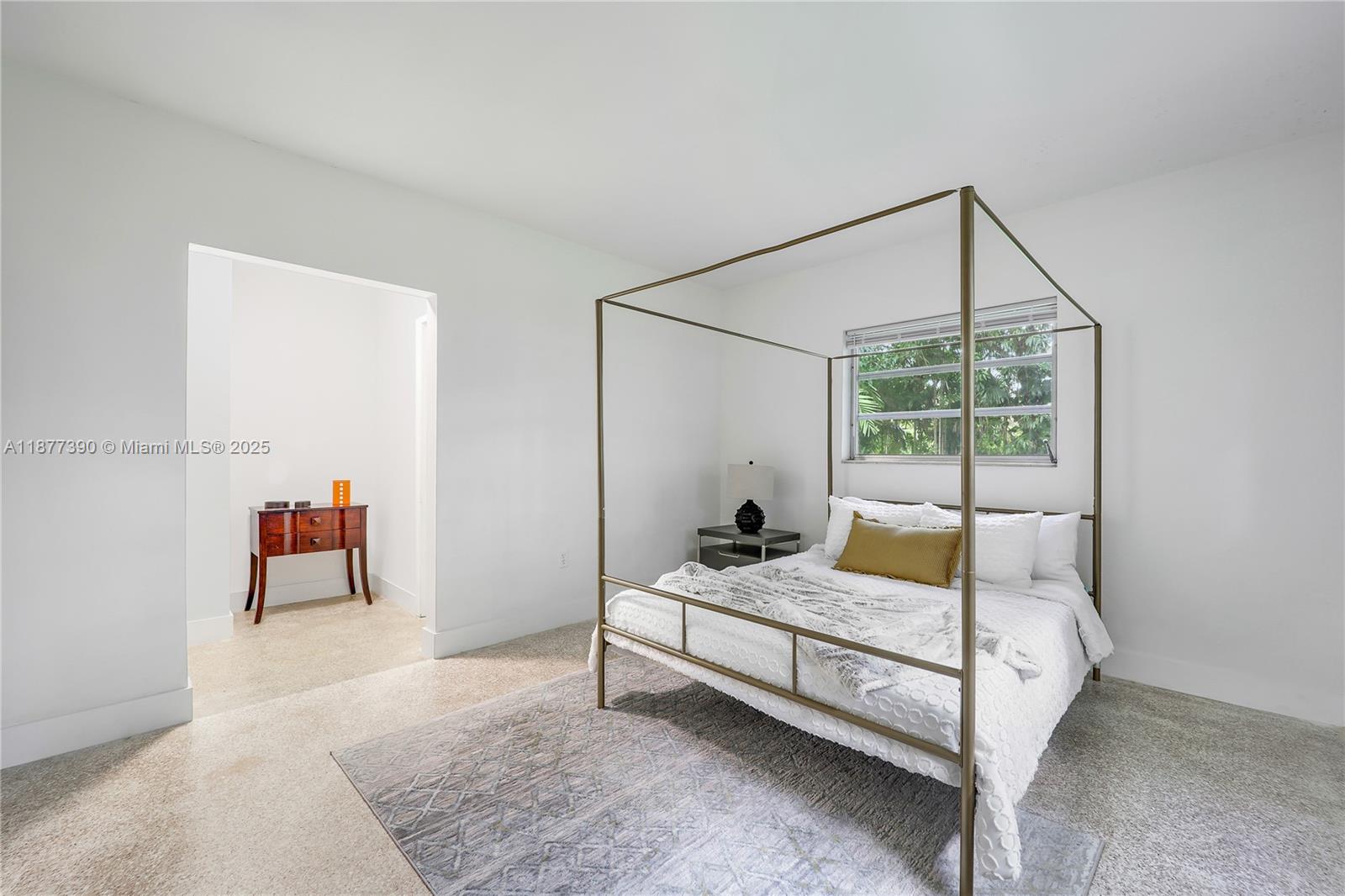 6445 Southwest 46th Terrace Miami, FL 33155 - Photo 10 of 22 a bedroom with a bed and a mirror