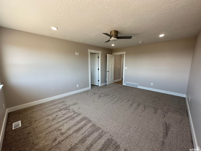 1171 West 2330 North Helper, UT 84526 - Photo 10 of 26 Unfurnished bedroom with recessed lighting, carpet floors, ceiling fan, and a textured ceiling