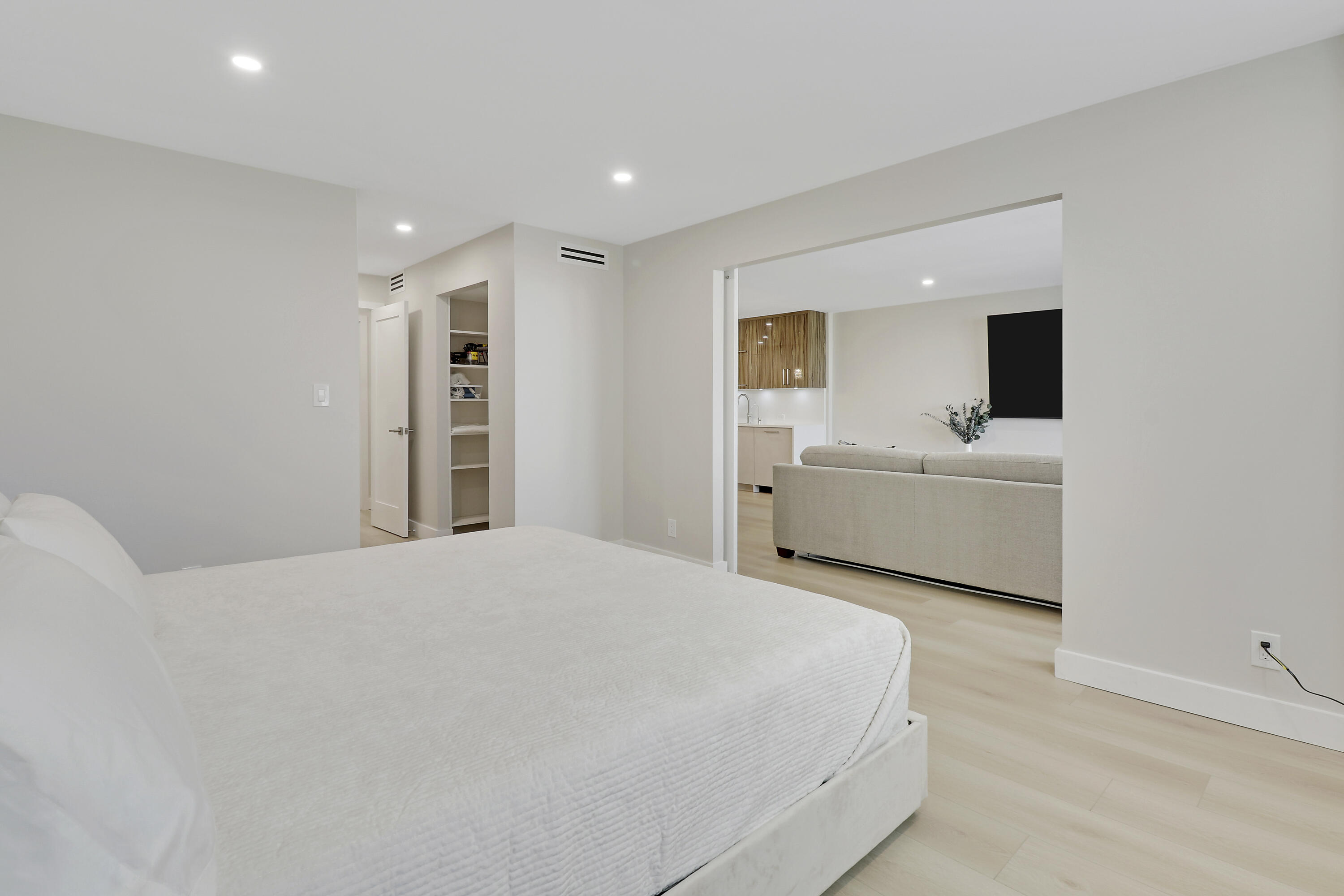 3540 South Ocean Boulevard, Unit 715 South Palm Beach, FL 33480 - Photo 11 of 39 a bedroom with a bed and a flat screen tv