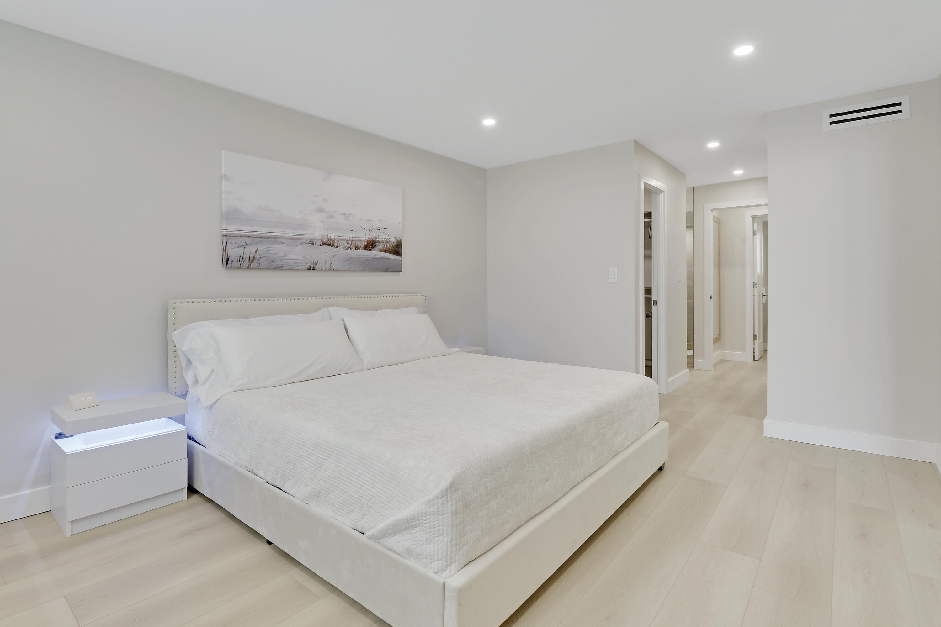 3540 South Ocean Boulevard, Unit 715 South Palm Beach, FL 33480 - Photo 12 of 39 a large white bed in a white room