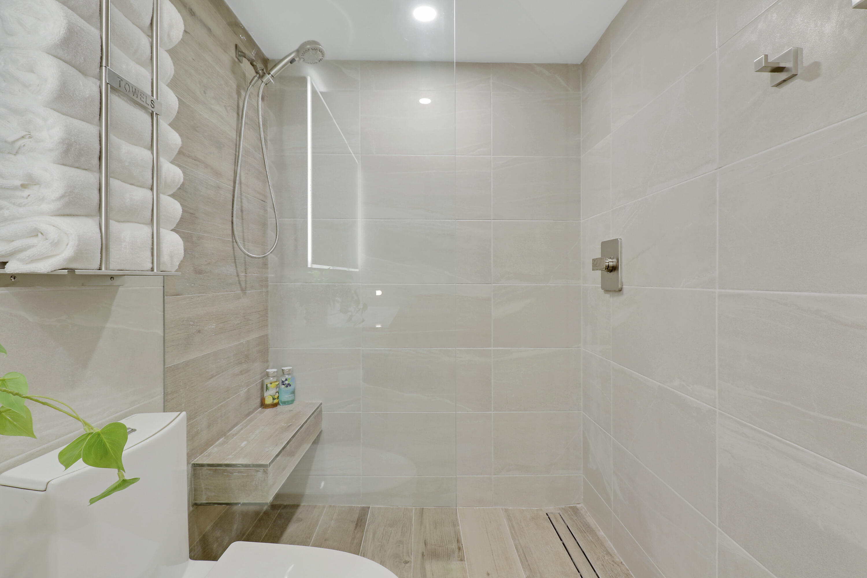 3540 South Ocean Boulevard, Unit 715 South Palm Beach, FL 33480 - Photo 16 of 39 a bathroom with a shower and a toilet