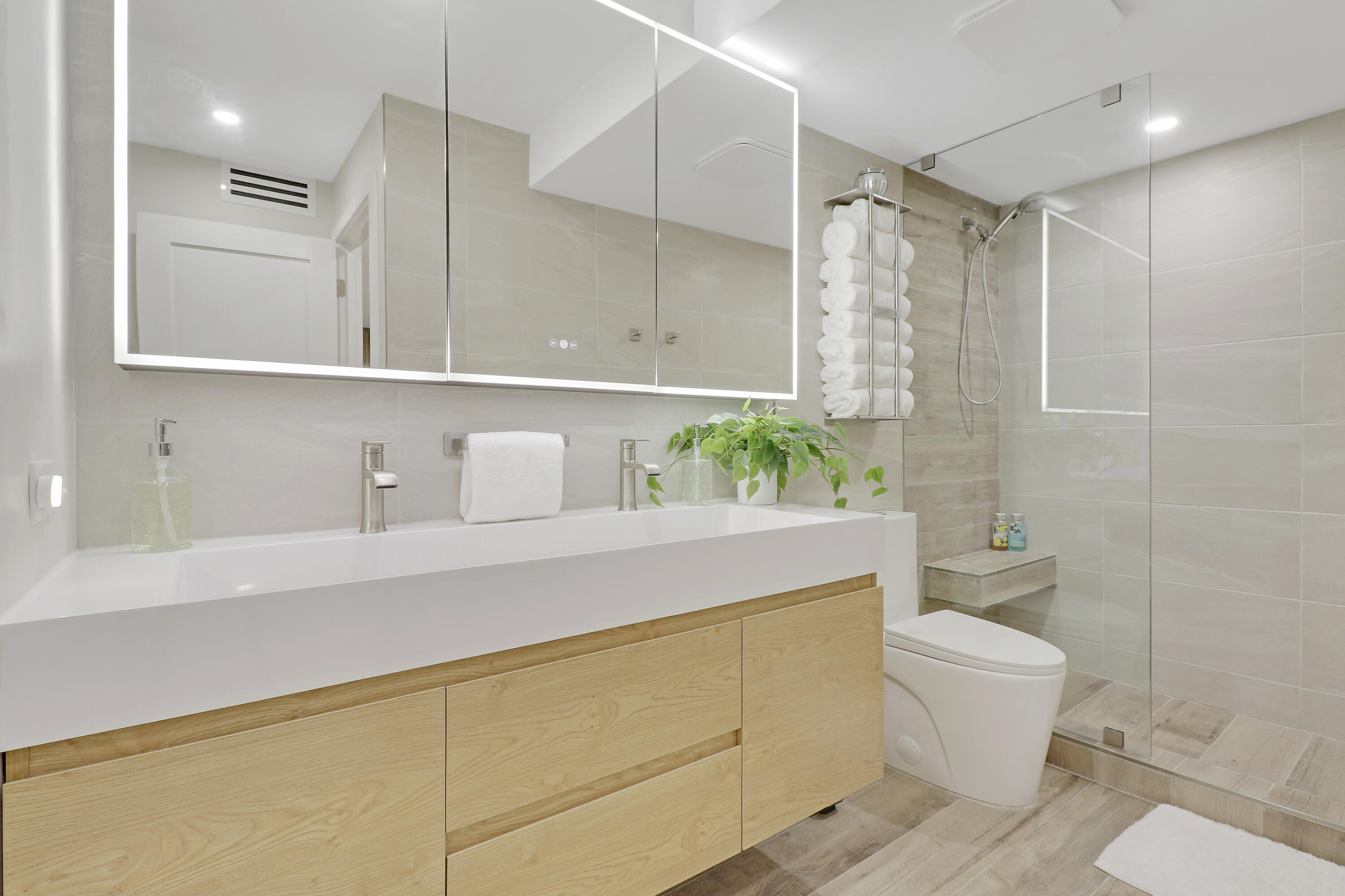 3540 South Ocean Boulevard, Unit 715 South Palm Beach, FL 33480 - Photo 17 of 39 a bathroom with a sink a toilet and shower