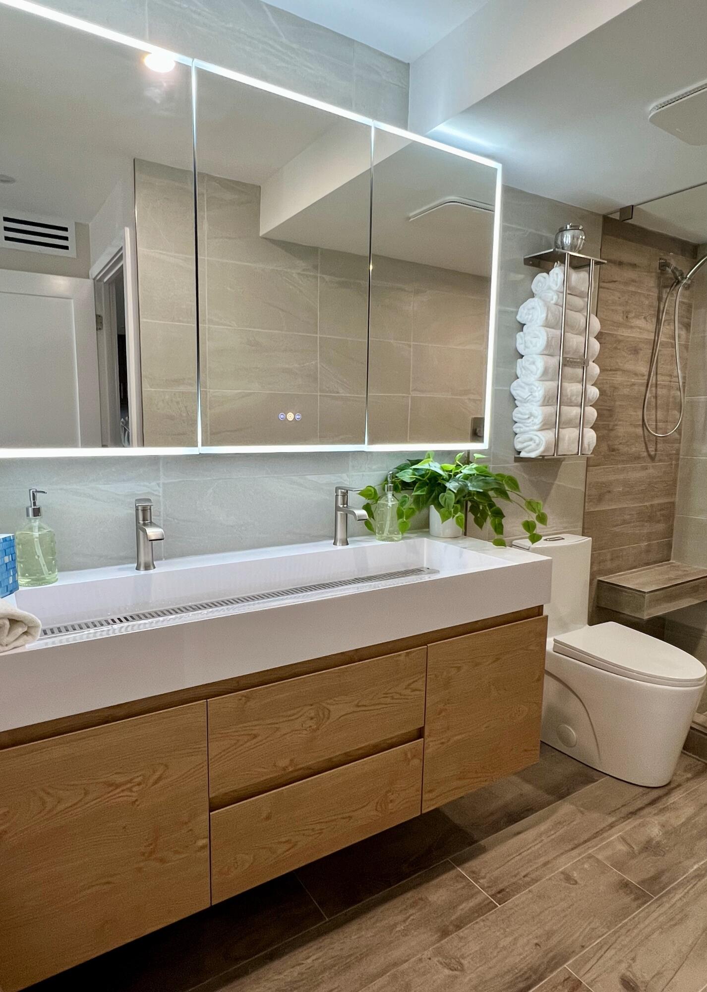 3540 South Ocean Boulevard, Unit 715 South Palm Beach, FL 33480 - Photo 19 of 39 a bathroom with a granite countertop sink and a mirror