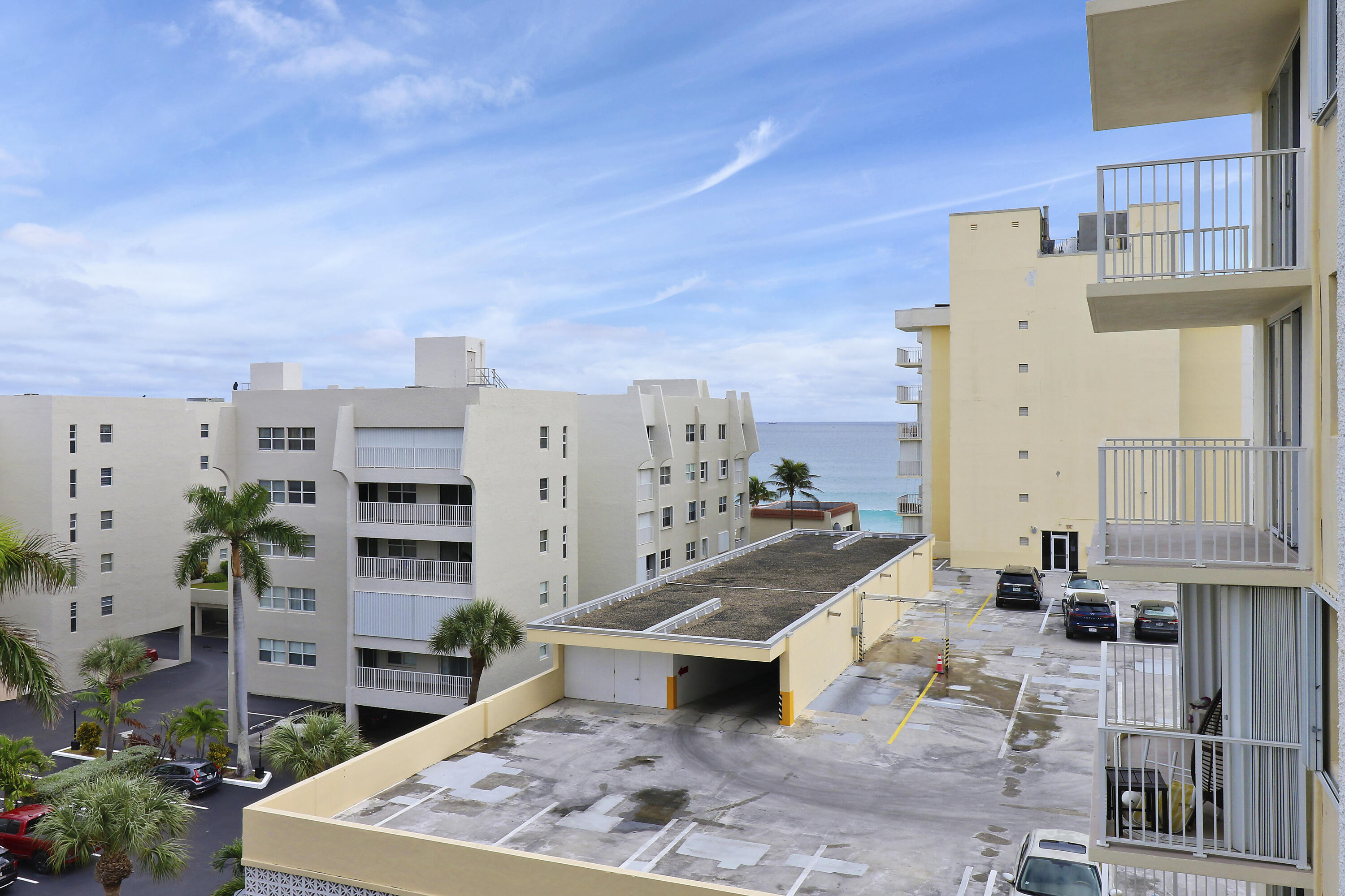 3540 South Ocean Boulevard, Unit 715 South Palm Beach, FL 33480 - Photo 21 of 39 an aerial view of a residential apartment building with a yard and seating space