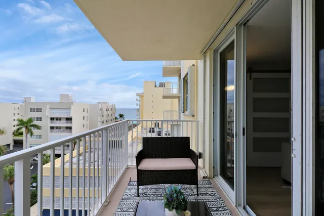 a view of balcony with a potted plant