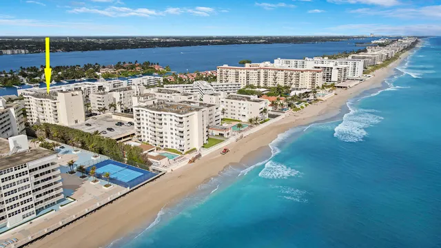 a view of a building with a yard