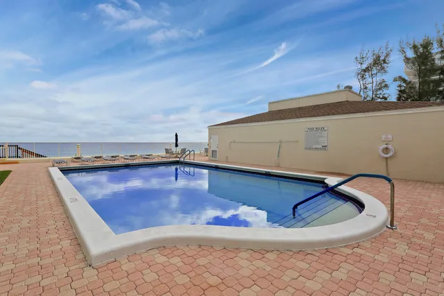 a view of multiple houses with a yard