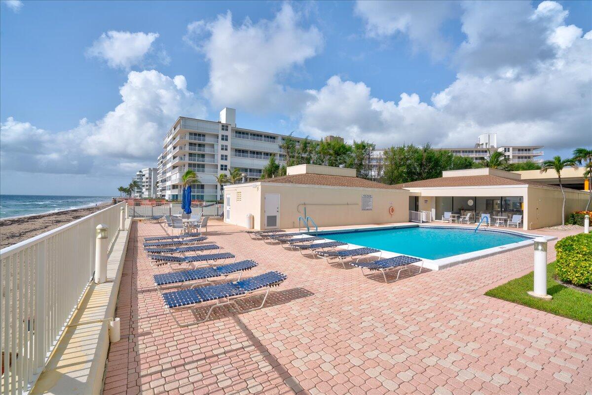 3540 South Ocean Boulevard, Unit 715 South Palm Beach, FL 33480 - Photo 35 of 39 a view of multiple houses with a yard
