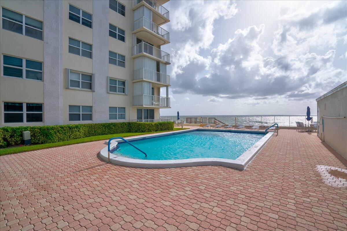 3540 South Ocean Boulevard, Unit 715 South Palm Beach, FL 33480 - Photo 36 of 39 a view of a swimming pool with a yard