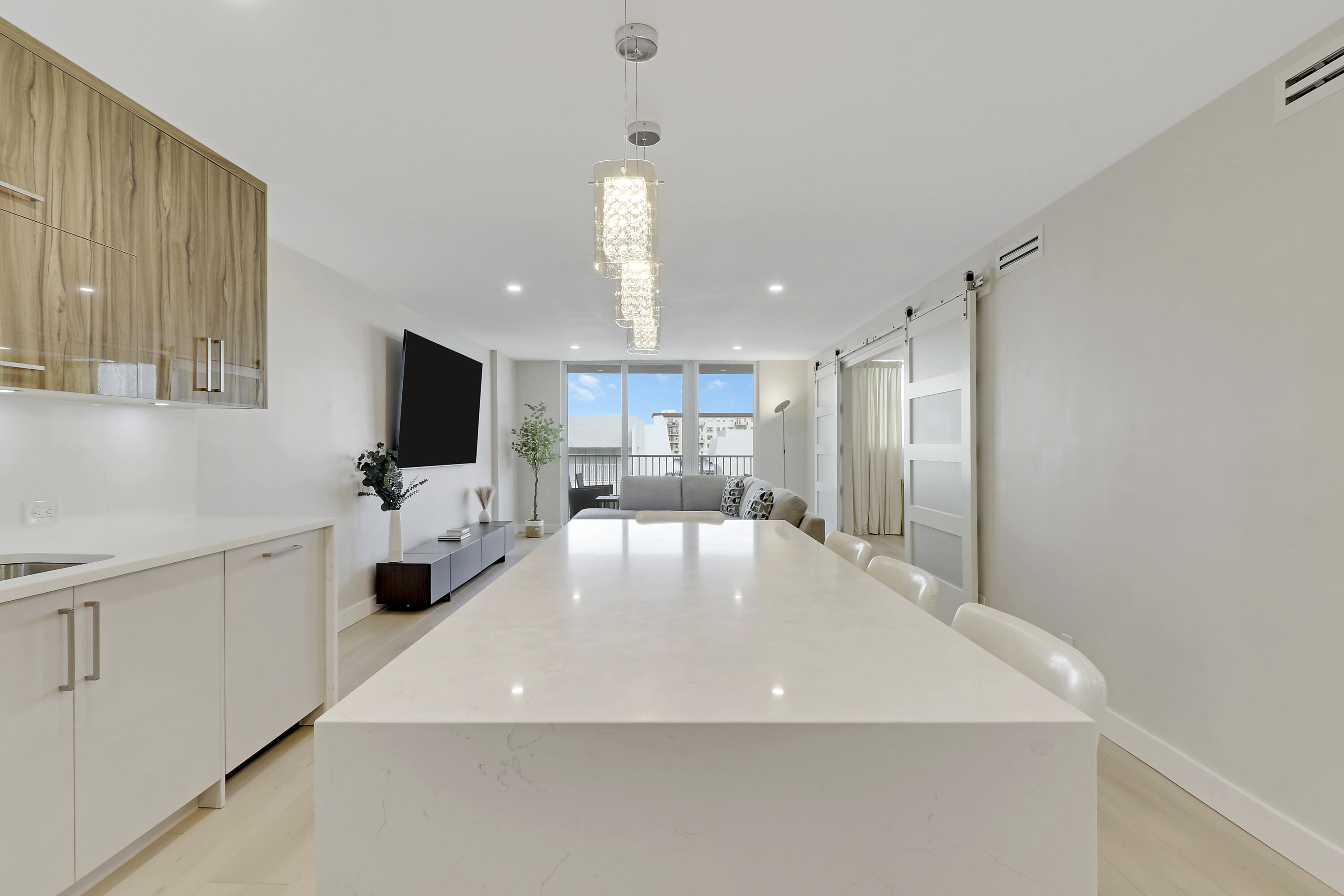 3540 South Ocean Boulevard, Unit 715 South Palm Beach, FL 33480 - Photo 5 of 39 a view of a kitchen with a sink and a refrigerator
