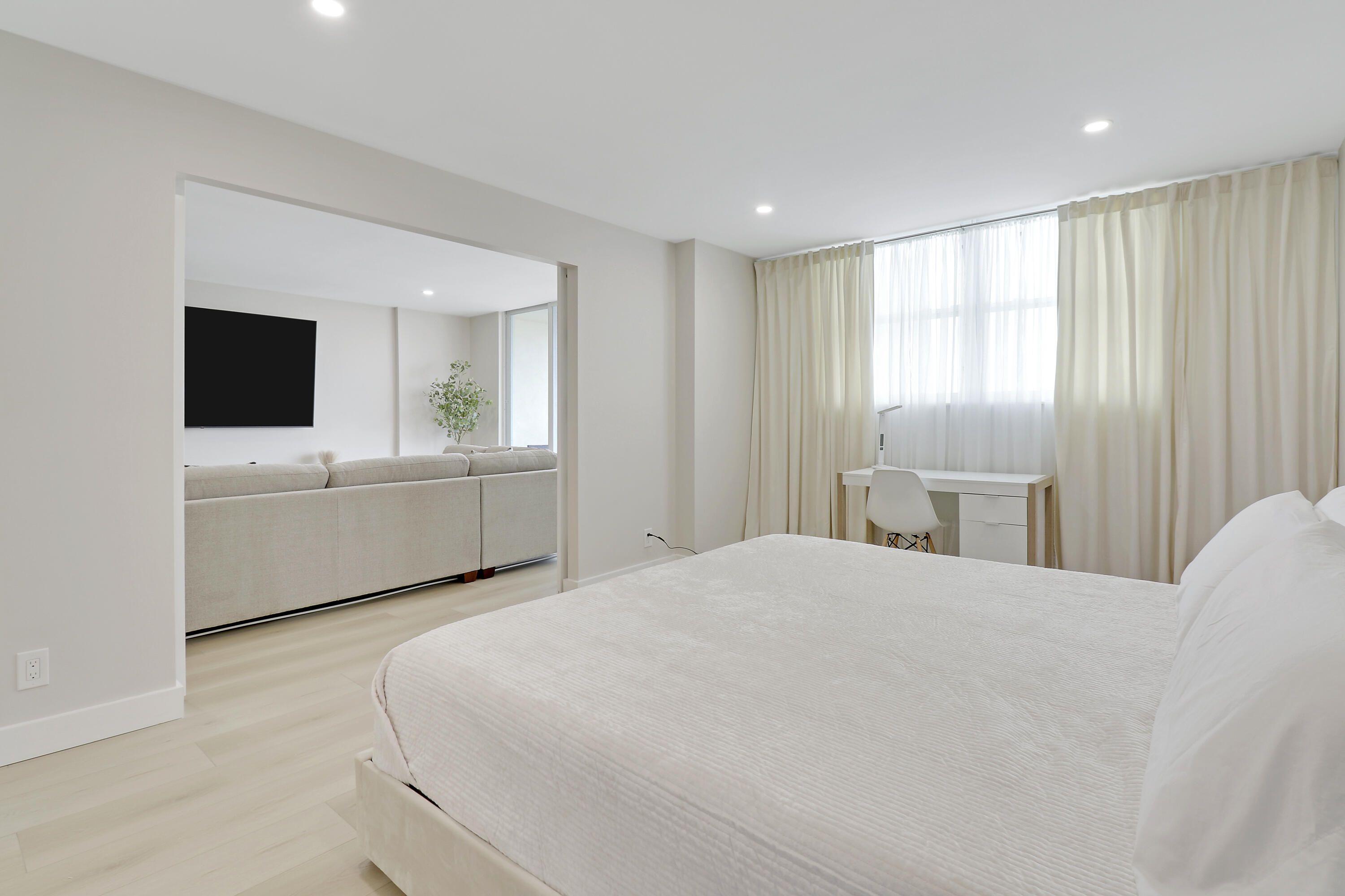 3540 South Ocean Boulevard, Unit 715 South Palm Beach, FL 33480 - Photo 10 of 39 a bedroom with a bed and a flat screen tv