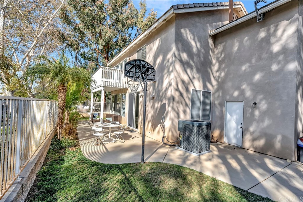 350 Exeter Way Corona, CA 92882 - Photo 20 of 55 a backyard of a house with table and chairs