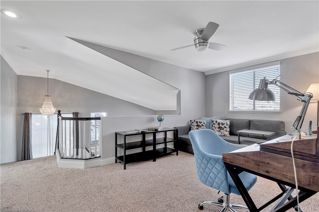 350 Exeter Way Corona, CA 92882 - Photo 30 of 55 a living room with furniture and a chandelier