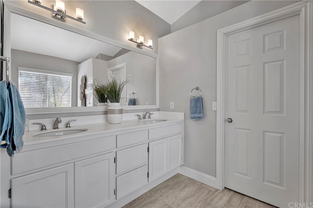 350 Exeter Way Corona, CA 92882 - Photo 36 of 55 a bathroom with a double vanity sink and mirror