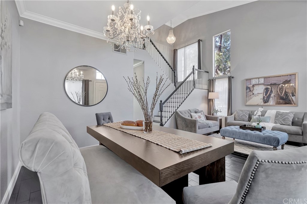 350 Exeter Way Corona, CA 92882 - Photo 43 of 55 a living room with furniture a table chandelier and a mirror