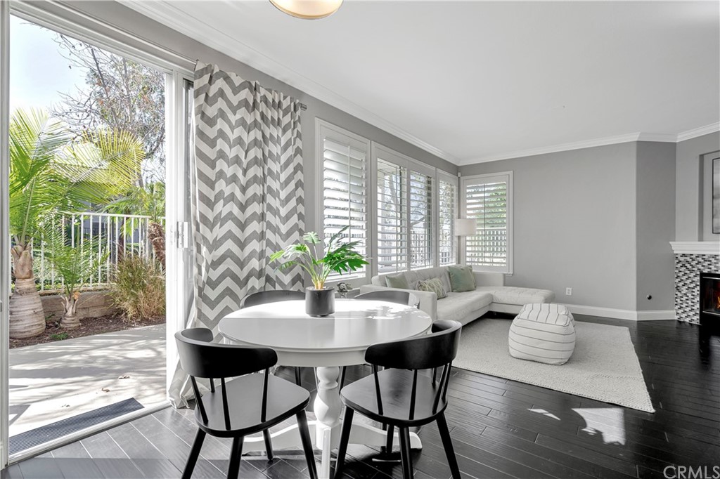 350 Exeter Way Corona, CA 92882 - Photo 48 of 55 a view of a dining room with furniture and wooden floor