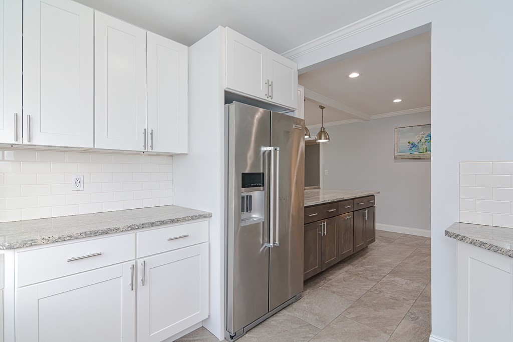 1059 Amostown Road West Springfield, MA 01089 - Photo 8 of 34 a kitchen with stainless steel appliances granite countertop a refrigerator and a sink
