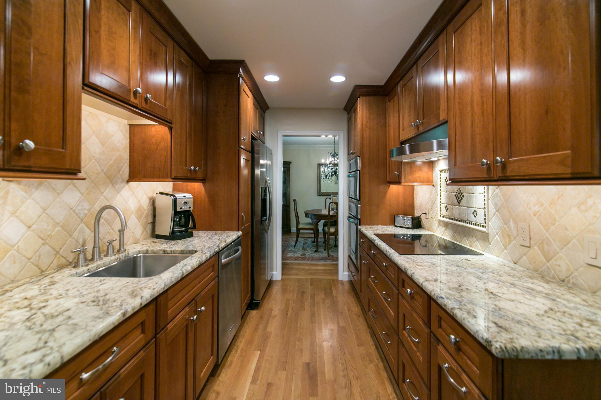12003 Trotter Lane Reston, VA 20191 - Photo 10 of 30 Kitchen with granite and KitchenAid appliances.