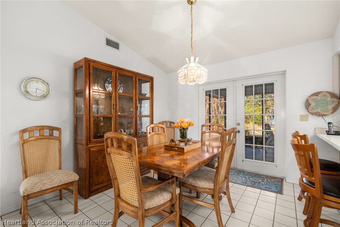 5802 Golden Road Sebring, FL 33875 - Photo 9 of 37 a dining room with furniture and window