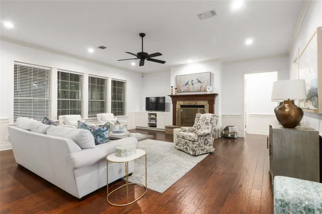 a living room with furniture a fireplace and a fireplace