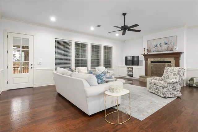 a spacious bedroom with a bed and a chandelier