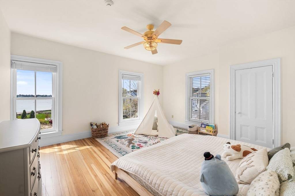 90 Puritan Road Swampscott, MA 01907 - Photo 27 of 42 a bed sitting in a bedroom next to a window
