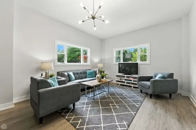 a living room with furniture and windows