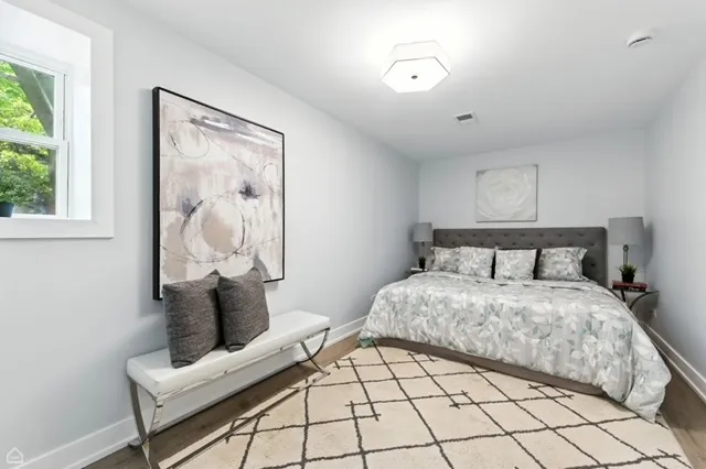 a bedroom with bed and window