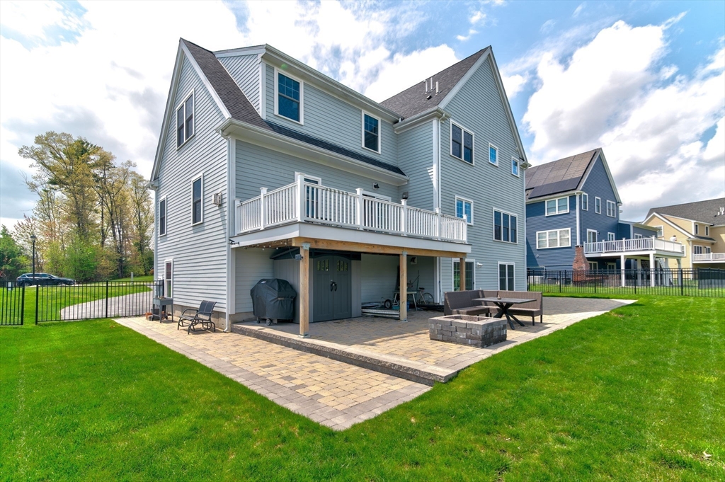 51 Tamarack Road Dracut, MA 01826 - Photo 35 of 39 a front view of a building with a garden and plants