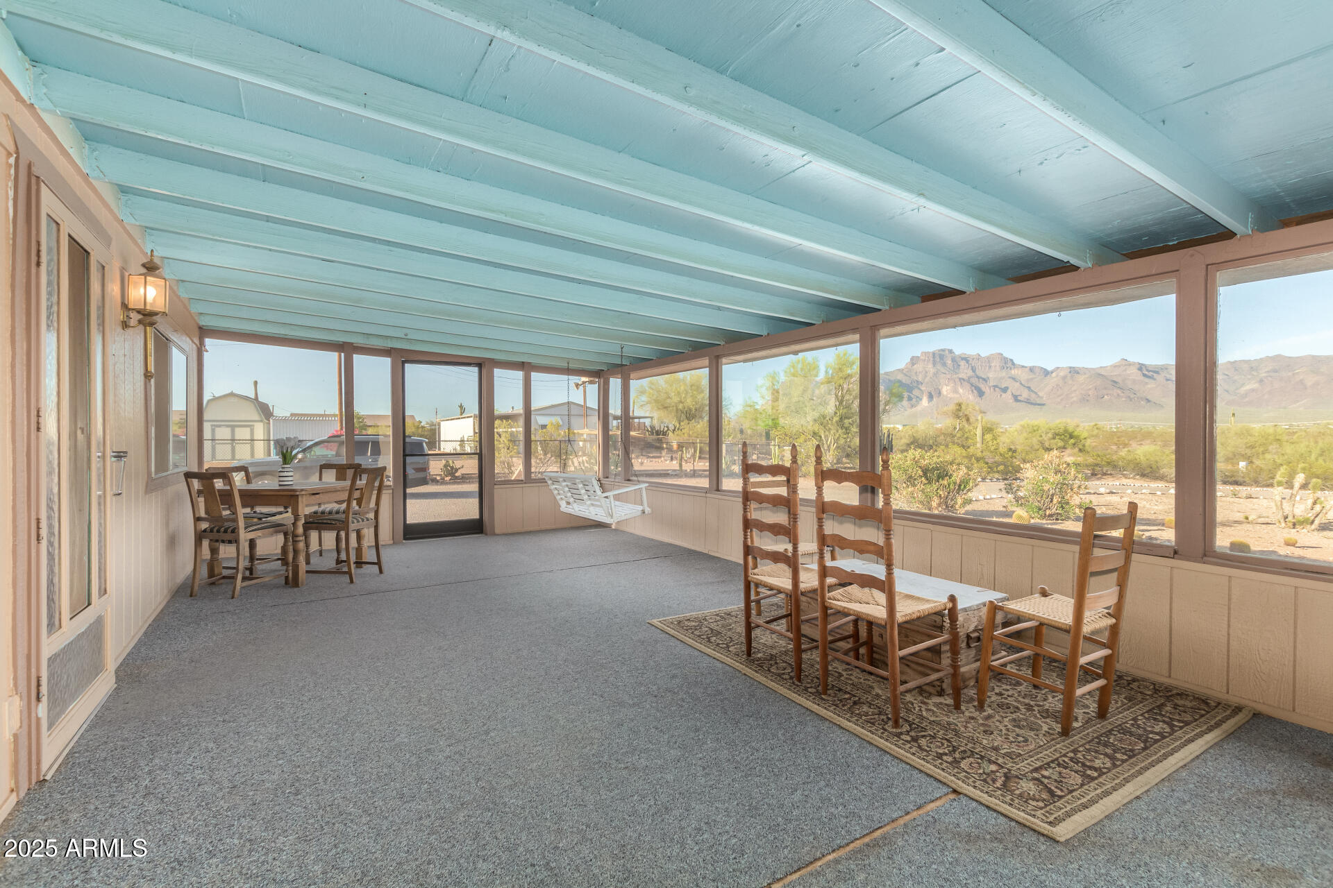 1888 South Goldfield Road Apache Junction, AZ 85119 - Photo 23 of 27 a living room with a large window and furniture