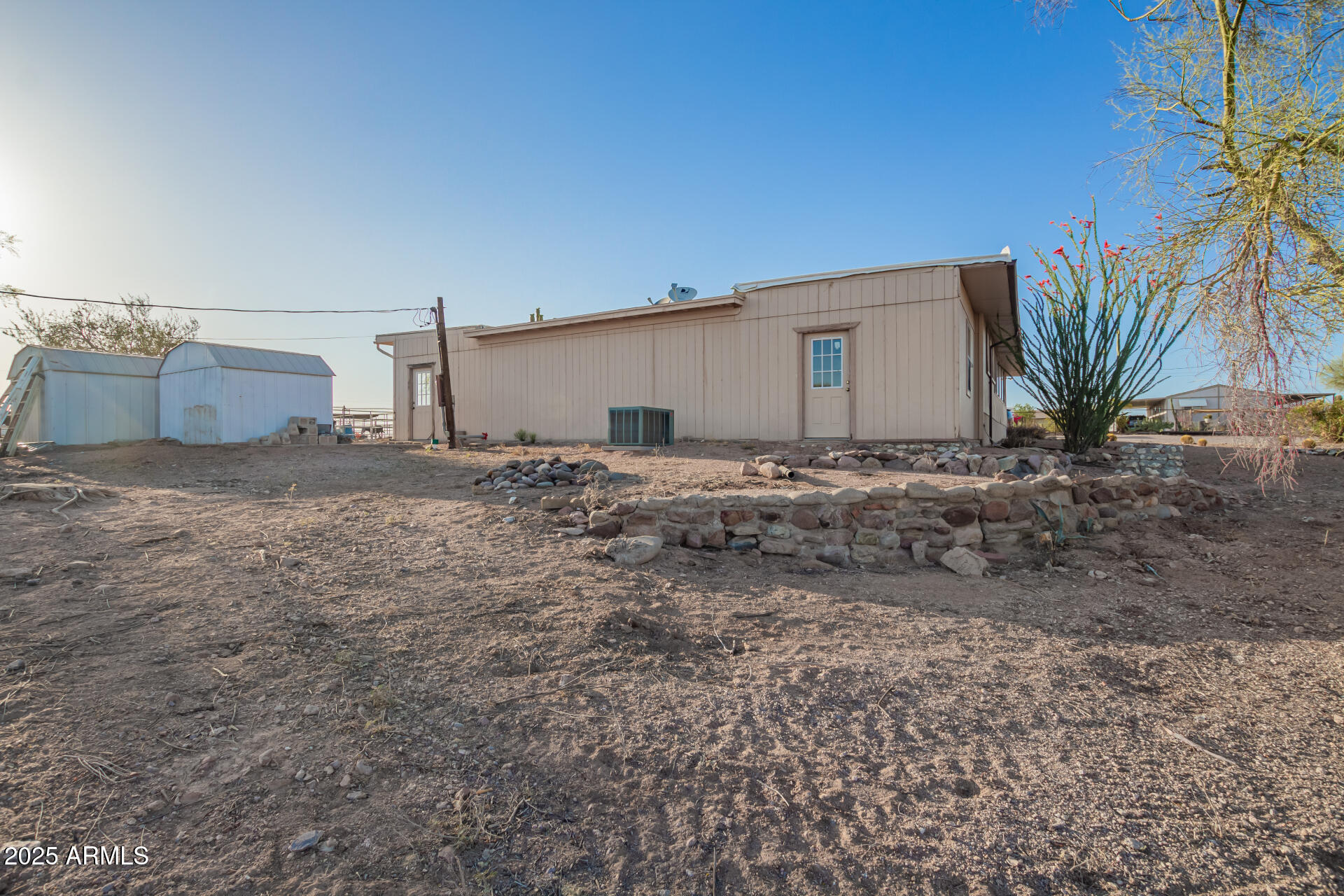 1888 South Goldfield Road Apache Junction, AZ 85119 - Photo 27 of 27 a big house with a yard and a garage