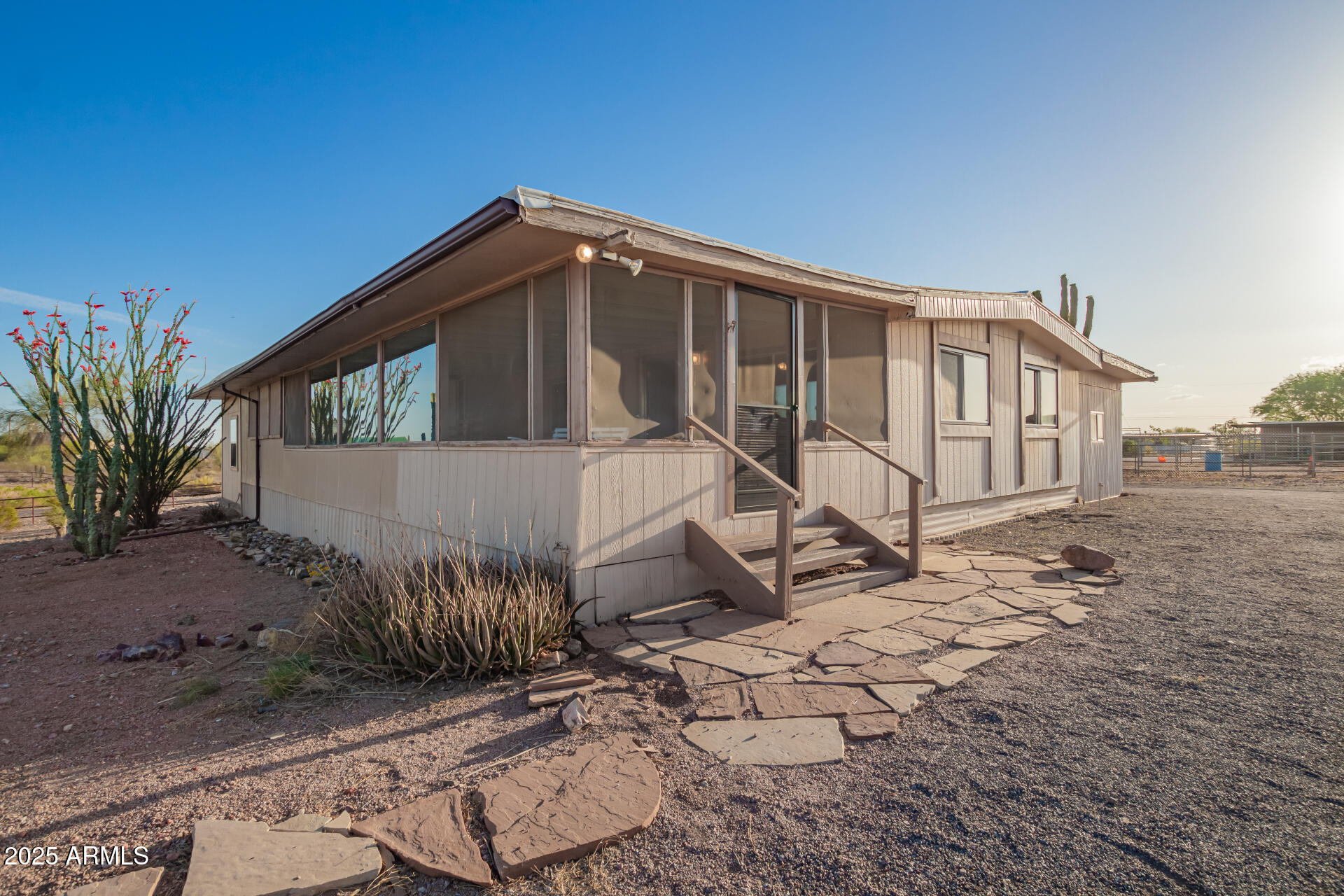 1888 South Goldfield Road Apache Junction, AZ 85119 - Photo 4 of 27 a view of a house with a yard