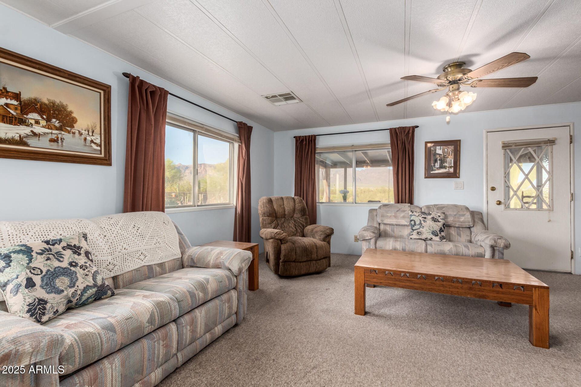 1888 South Goldfield Road Apache Junction, AZ 85119 - Photo 5 of 27 a living room with furniture and a large window