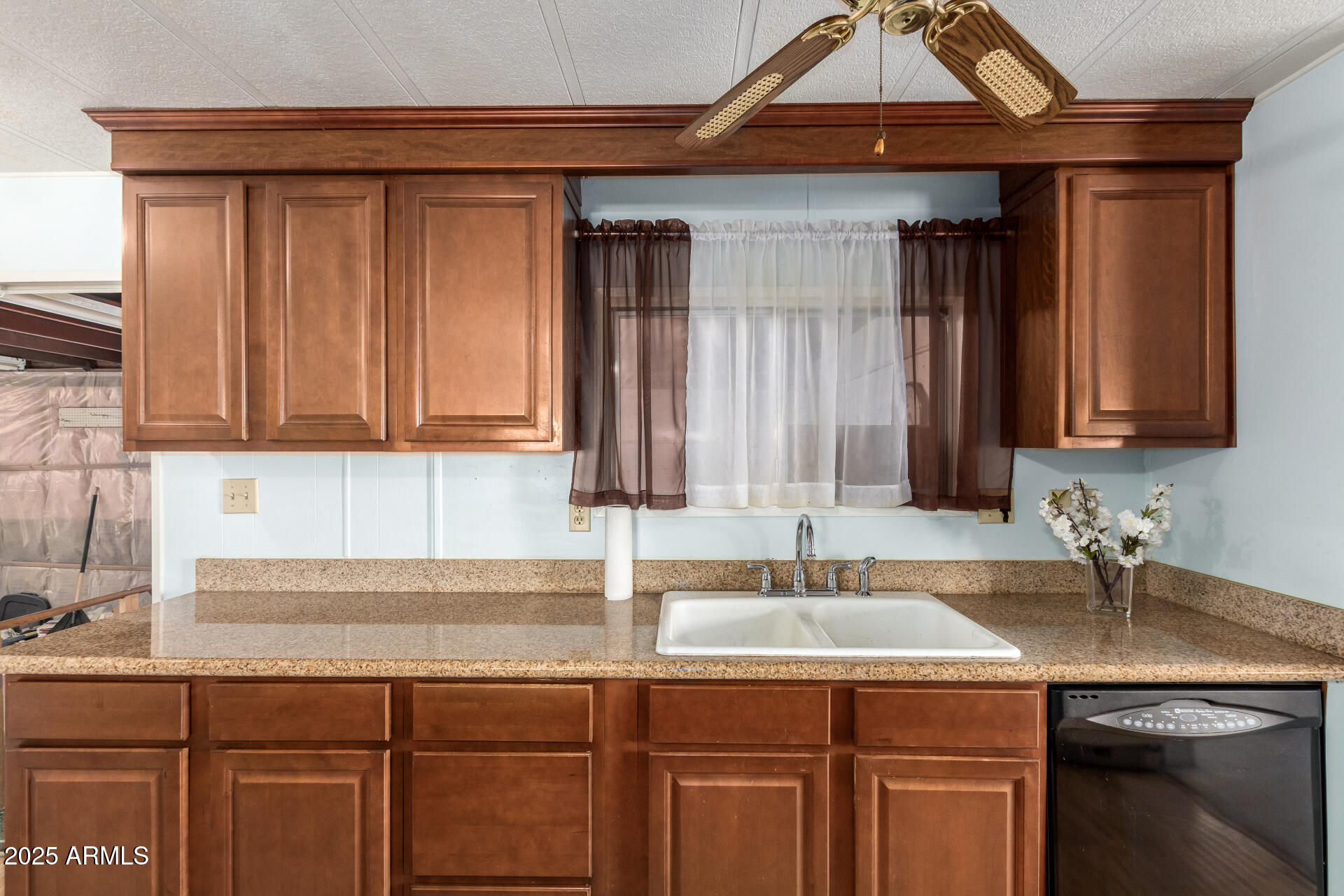 1888 South Goldfield Road Apache Junction, AZ 85119 - Photo 7 of 27 a kitchen with a sink and cabinets